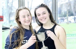 Captain Charlotte Newman and vice-captain Ellie Winter collect the women's trophy